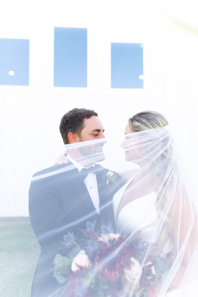 Bride and groom veil photo outdoors taken by cecilly elaine photography