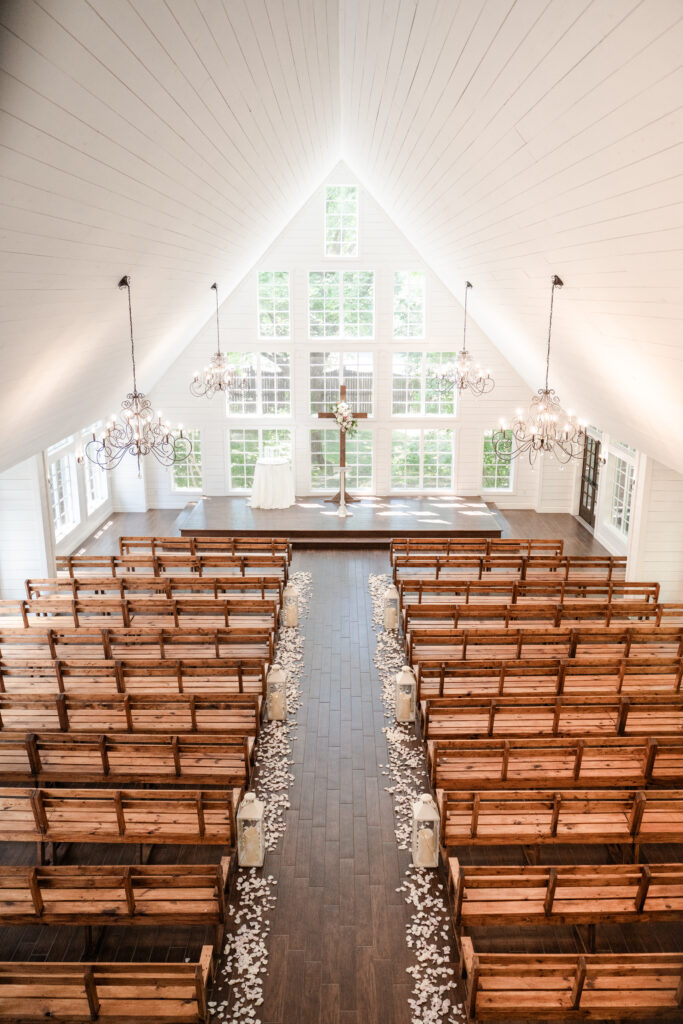 The view of white wedding chapel from the balcony before the wedding ceremony begins by cecilly elaine photography