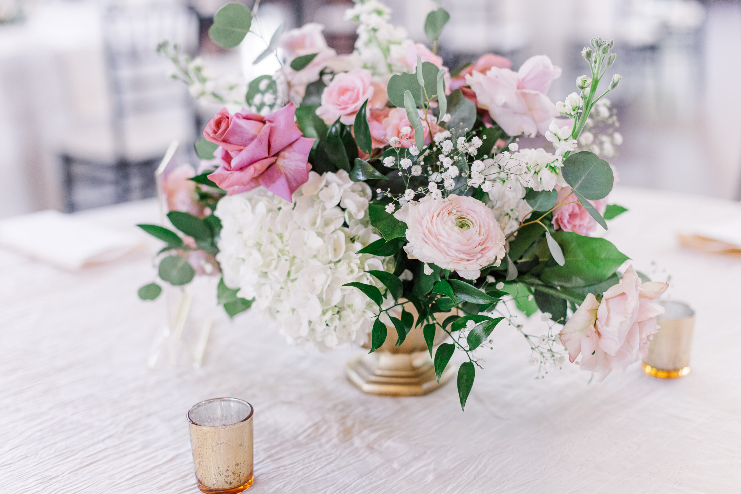 Beautiful pink and white floral wedding centerpiece by cecilly elaine photography