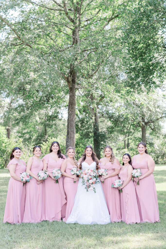 Bride and bridesmaids in pink by wedding photographer cecilly elaine