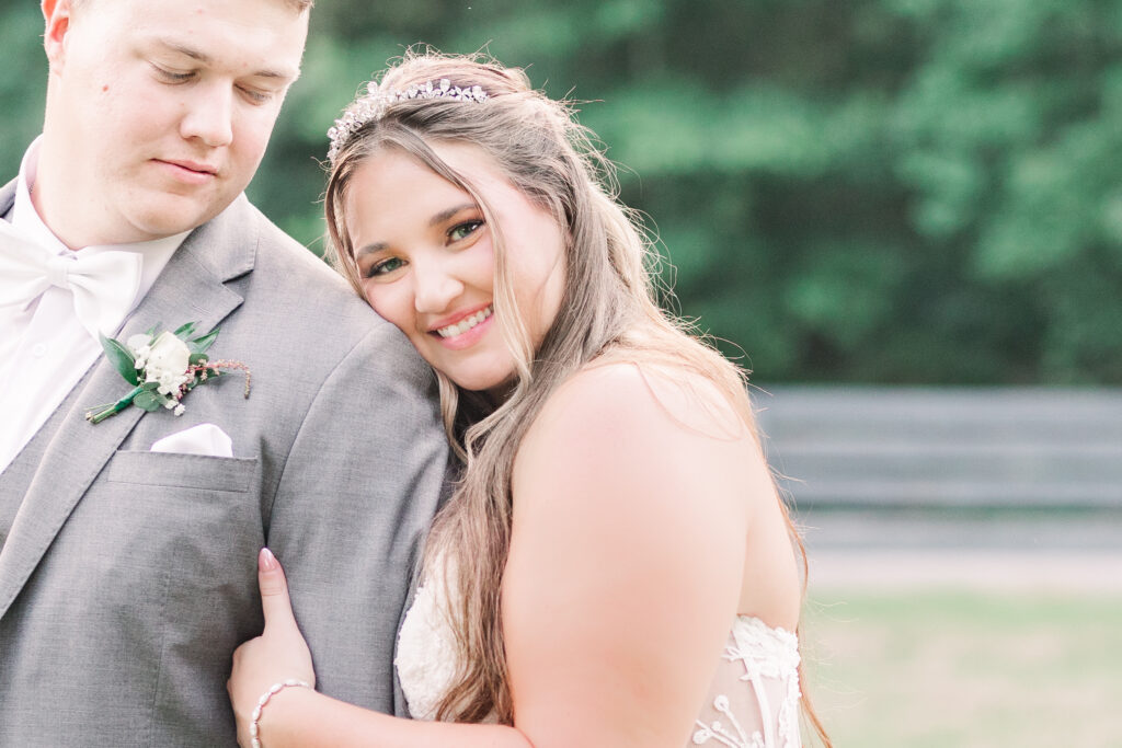 At a Houston wedding venue bride rests her head on the groom's shoulder